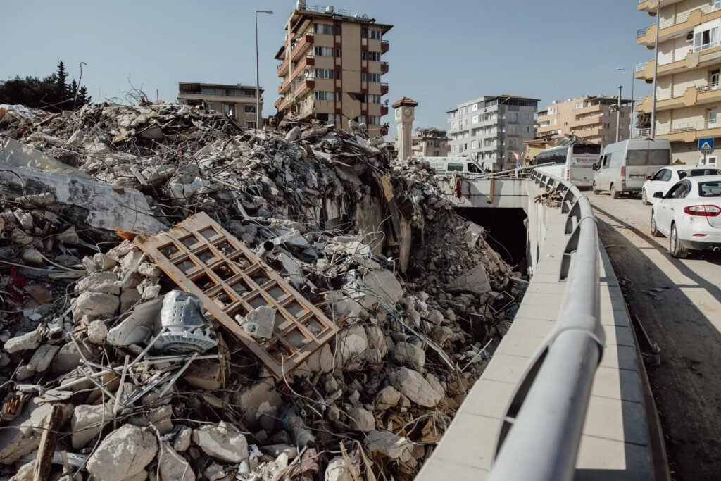 A city scene showing extensive earthquake damage with debris and ruins.